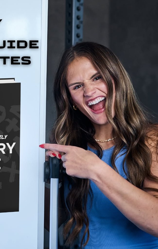 Coach Kelsey Poulter holding the Grocery Guide