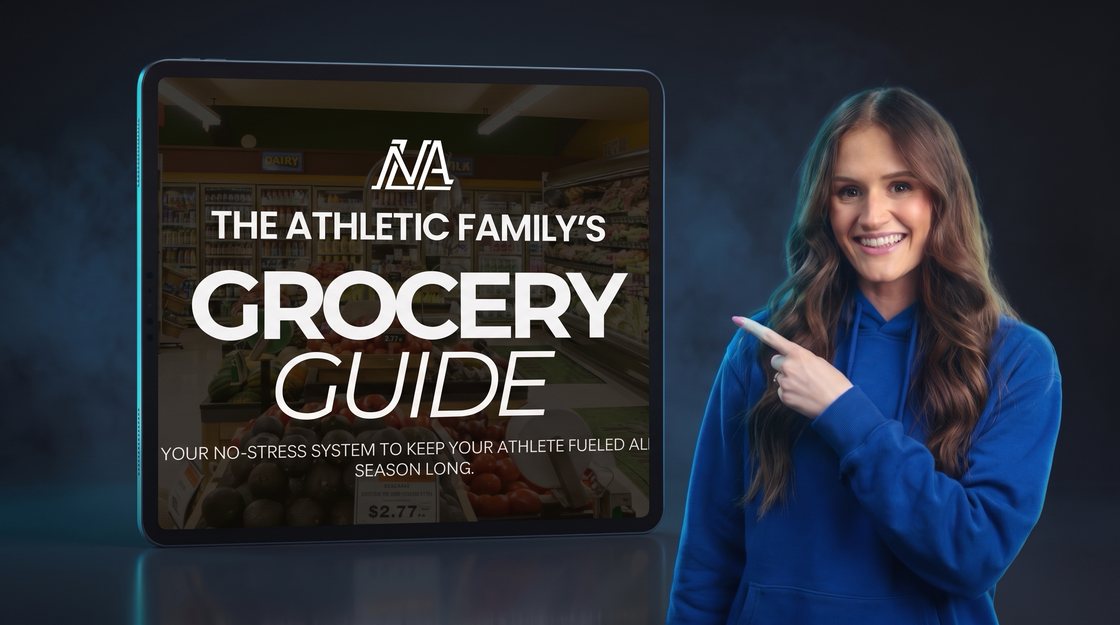 Coach Kelsey pointing at The Athletic Family's Grocery Guide